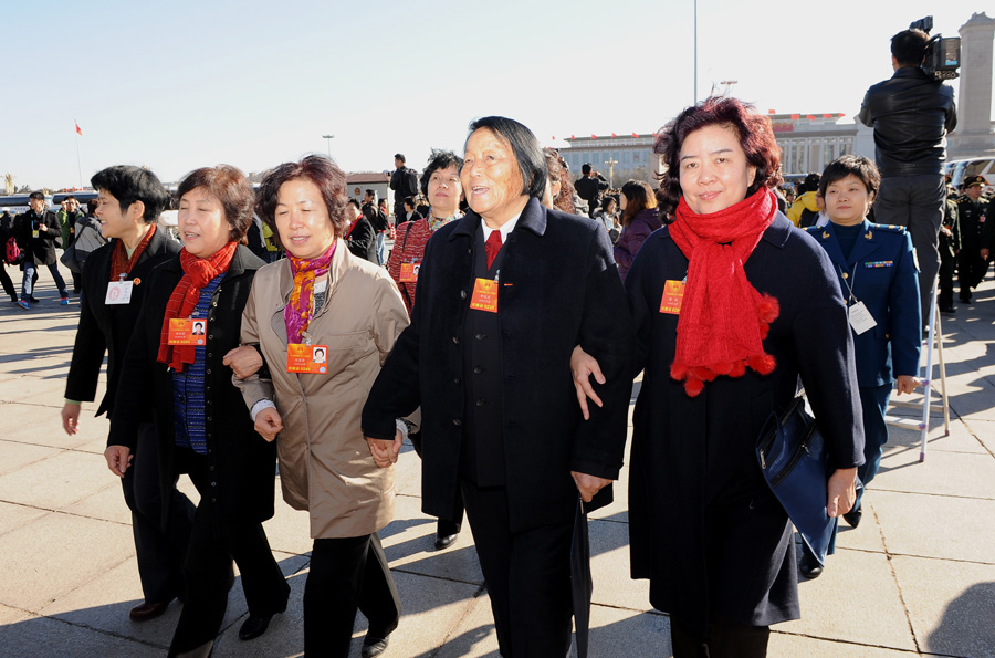 Deputies to the 12th National People's Congress (NPC) arrive at the Tian'anmen Square in Beijing, capital of China, March 4, 2013. The preparatory meeting for the first session of the 12th NPC was held in Beijing on March 4. [Xinhua/Yang Zongyou]