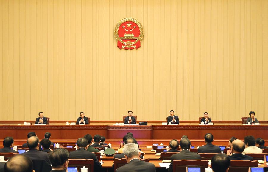 The presidium of the first session of the 12th National People's Congress (NPC) holds their first meeting at the Great Hall of the People in Beijing, capital of China, March 4, 2013. (Xinhua/Lan Hongguang) 