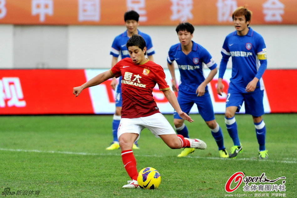 Dario Conca of Evergrande scored the penalty to pull one goal back for his team. 