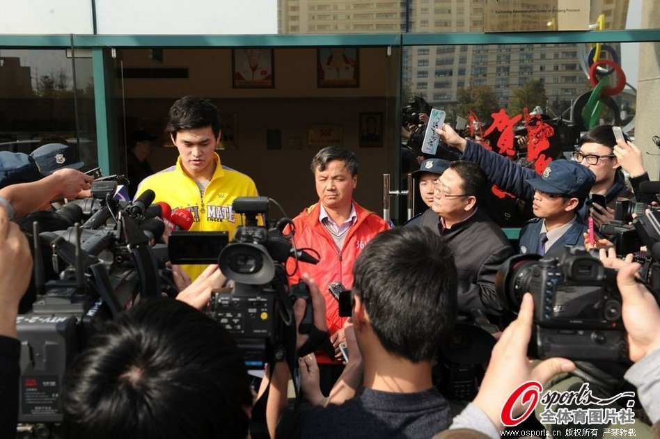 Chinese swimmer Sun Yang (left) hugs his coach Zhu Zhigen in front of a media session before his training in Hangzhou, Zhejiang province, on Monday. The pair appear to reunite after reportedly becoming embroiled in a dispute last month. 