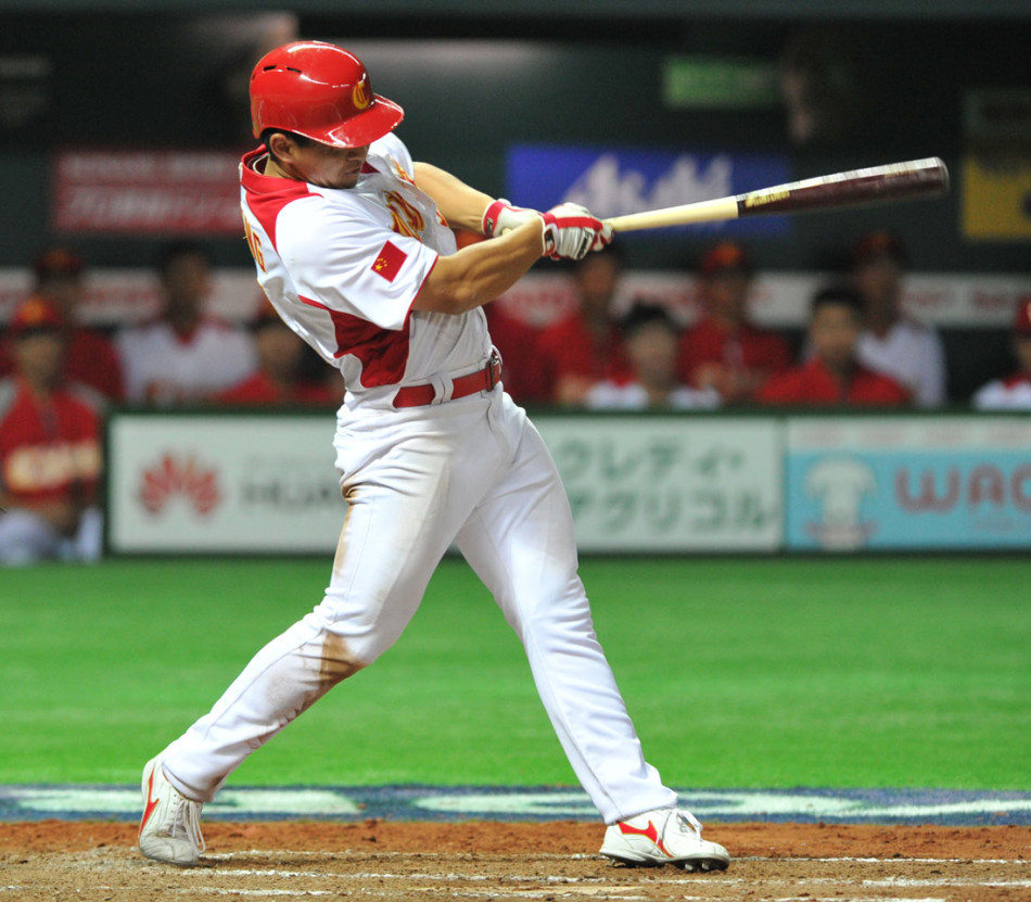 China's player hits a ball in the match against Brasil at the World Baseball Classic yesterday in Fukuoka, Japan on March 5, 2013.