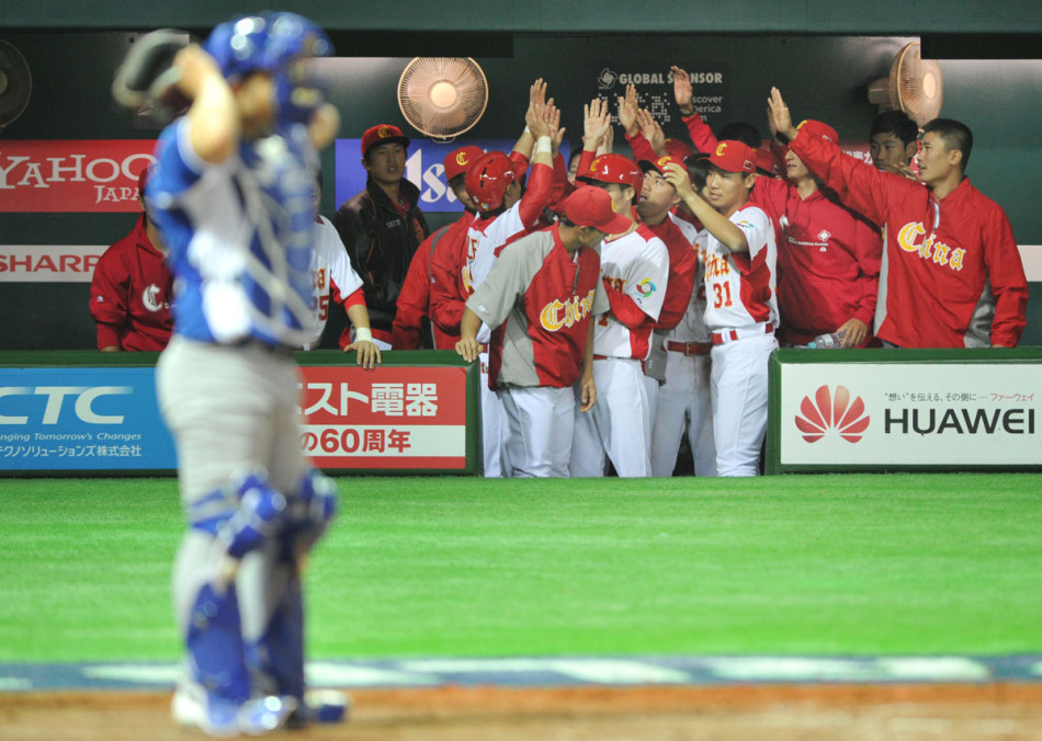 China's players celebrate defeating Brazil at the World Baseball Classic yesterday in Fukuoka, Japan on March 5, 2013. 