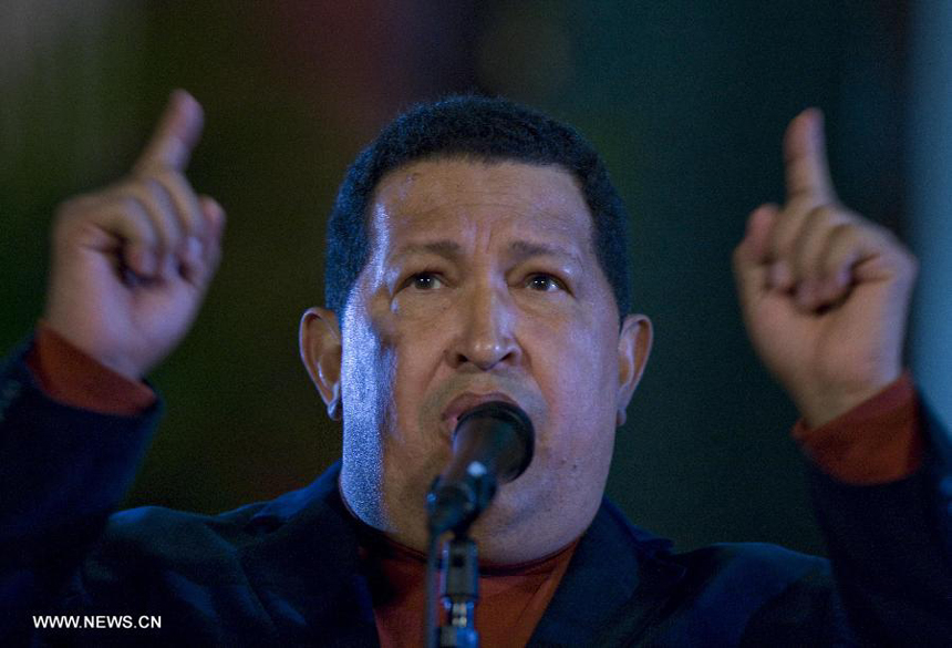 File photo taken on Oct. 6, 2012 shows Venezuelan President Hugo Chavez attending a press conference in Caracas, capital of Venezuela. Venezuelan government confirmed President Hugo Chavez&apos;s death on March 5, 2013. 