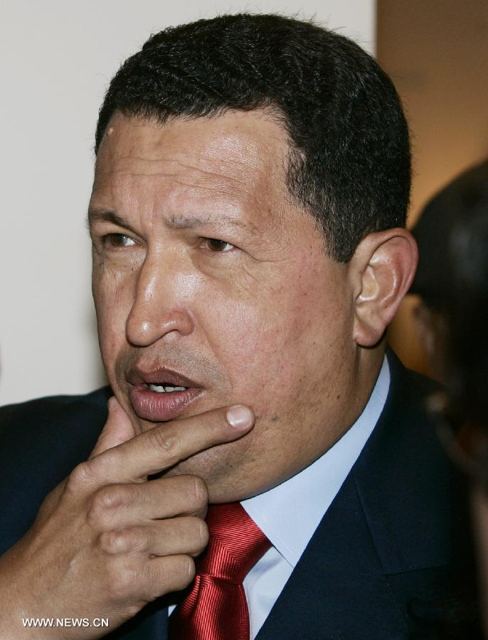 File photo taken on Nov. 4, 2005 shows Venezuelan President Hugo Chavez listening to questions at the 4th Summit of the Americas in Mar del Plata, Argentina. Venezuelan government confirmed President Hugo Chavez&apos;s death on March 5, 2013. 