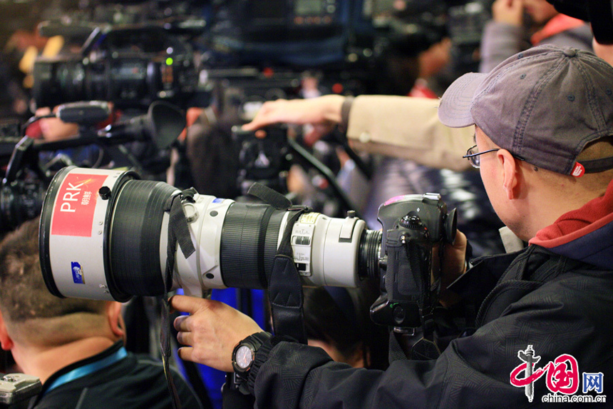 A reporter from the People&apos;s Democratic Republic of Korea (DPRK) covers the press conference of the First Session of the 12th National People&apos;s Congress on March 4, 2013. 