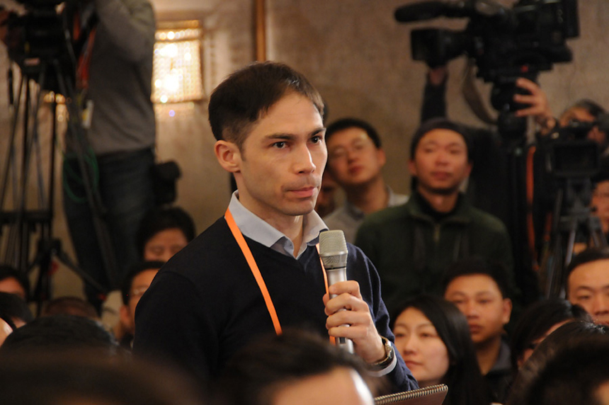 A Reuters reporter asks questions during the press conference of the First Session of the 12th National People's Congress on March 4, 2013. 