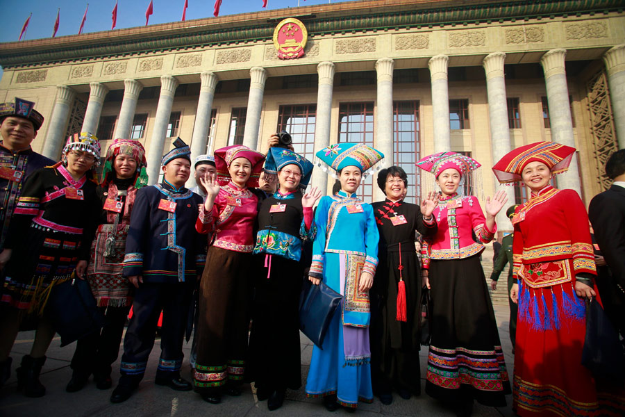 Women deputies from different ethnic groups pose for a photo in front of the Great Hall of the People during the annual session of the National People's Congress, in Beijing, March 5, 2013. A total of 699 women, 23 percent of the NPC deputies, are taking part in this year's conference. [Photo/Asianewsphoto]