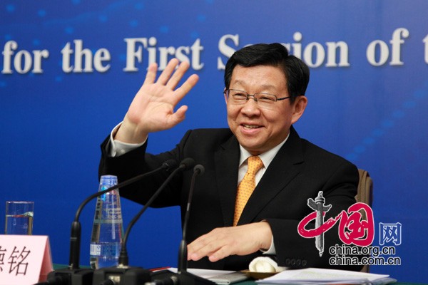 A press conference is held by the first session of the 12th National People&apos;s Congress (NPC) in Beijing, capital of China, March 8, 2013. Chinese Minister of Commerce Chen Deming answers questions at the press conference.
