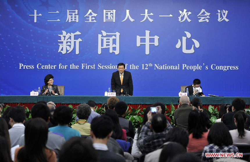 A press conference is held by the first session of the 12th National People&apos;s Congress (NPC) in Beijing, capital of China, March 8, 2013. Chinese Minister of Commerce Chen Deming answers questions at the press conference.