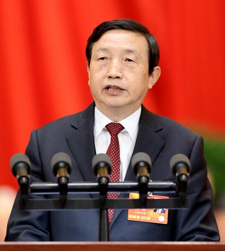 Chinese State Councilor Ma Kai delivers a report to China's top legislature on Mar. 10, 2013, elaborating the State Council's plan of institutional restructuring and function transformation. [Xinhua] 