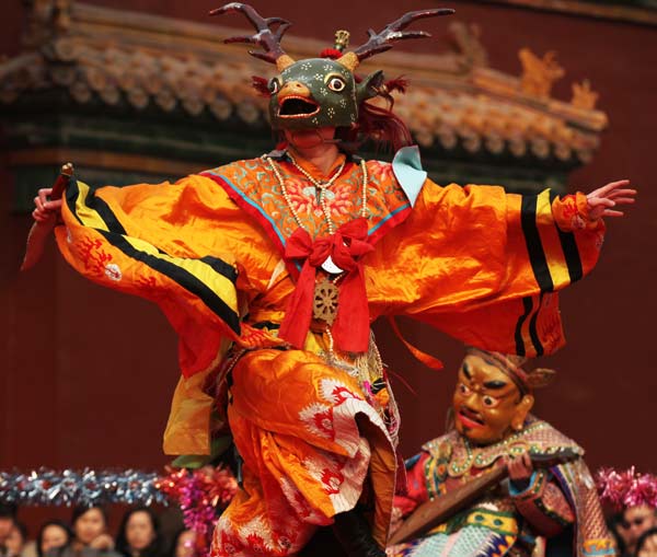 A lama performs a traditional Buza Dance in Beijing's Yonghegong Lama Temple on Monday, as part of an annual ritual to pray for prosperity. [Photo / China Daily]