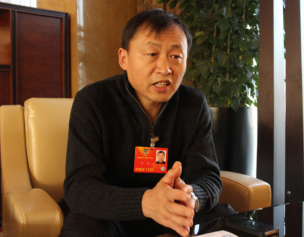 Professor Wang Ming from Tsinghua University says that he started to pay attention to families who lost their only child when he wrote his proposal to suggest that the country revise its family planning policy. [Photo/CRIENGLISH.com]