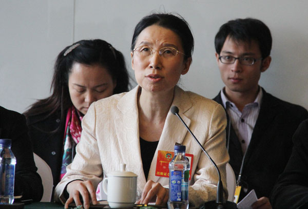 Yang Jia, vice-chair of the UN Committee on the Rights of Persons with Disabilities, participates in a group discussion. [Photo/CRIENGLISH.com]