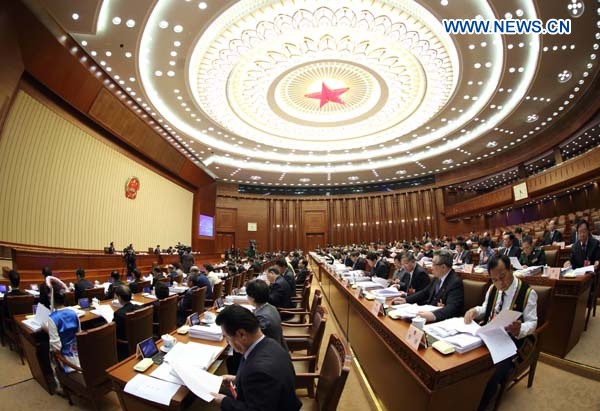 The presidium of the first session of the 12th National People's Congress (NPC) hold their third meeting at the Great Hall of the People in Beijing, capital of China, March 12, 2013. (Xinhua