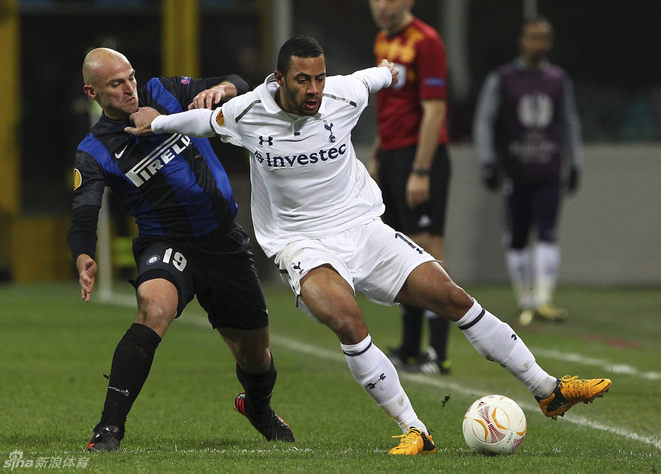 Mousa Dembele holds off the threat of Javier Zanetti. 