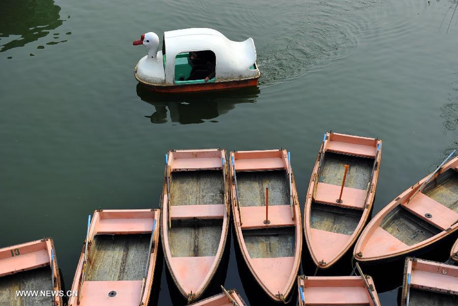 Citizens row on a lake at the botanical garden during the early Spring in Jinan City, capital of east China&apos;s Shandong Province, March 16, 2013.