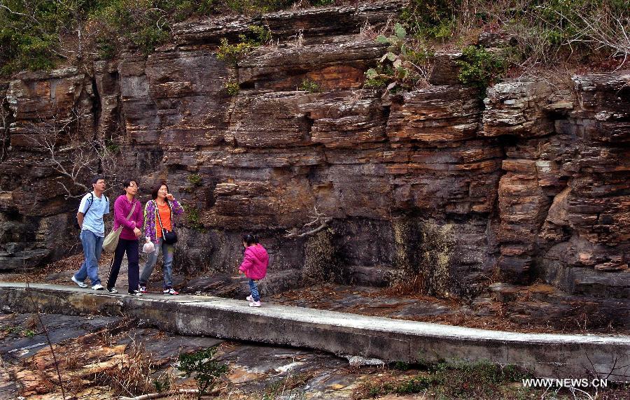 Tourists walk on a small path on the Tung Ping Chau island of south China's Hong Kong, March 17, 2013.