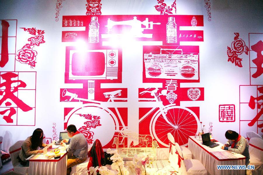 Photo taken on March 16, 2013 shows an exhibition booth of the 2013 Xici Wedding Expo for Spring in Nanjing, capital of east China's Jiangsu Province.