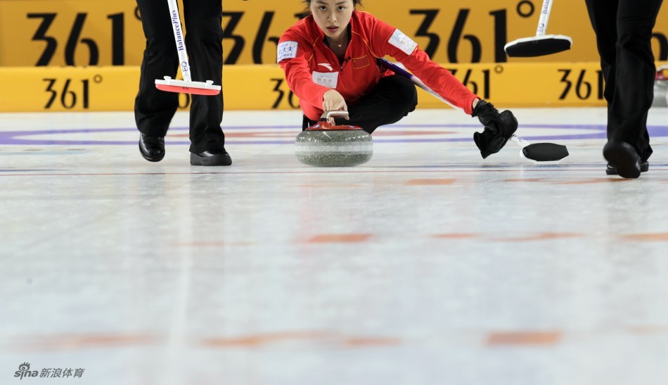 China's second Yue Qinghuang delivers a stone during their World Women's Curling Championship qualification round match against Sweden in Riga, March 19, 2013. 