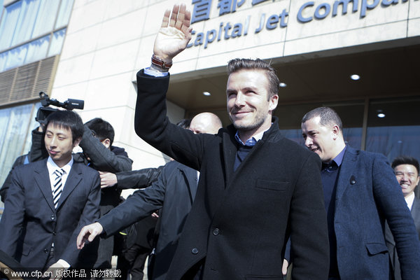 British soccer star David Beckham arrives in Beijing for a 4-day China visit as the promotion ambassador for the Chinese Super League, March 20, 2013.