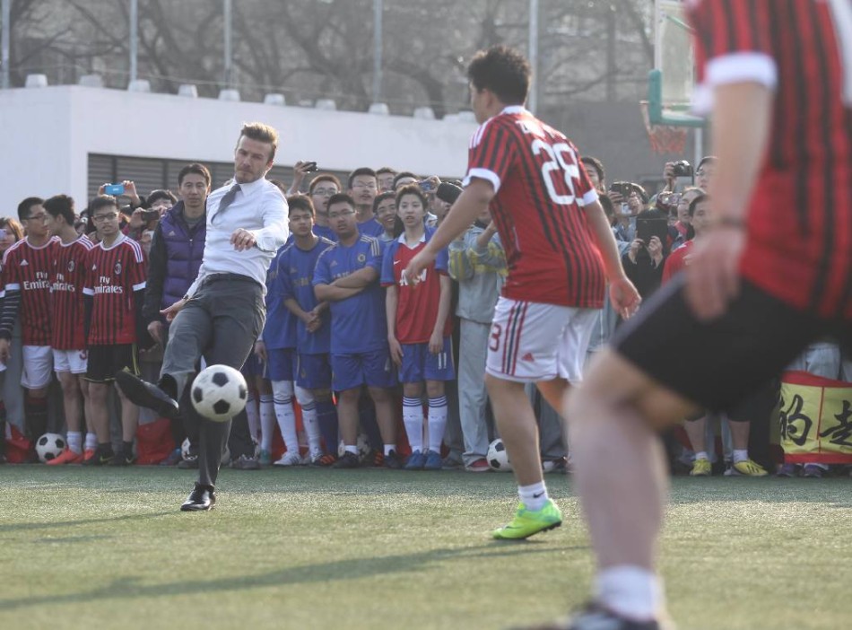 David Beckham plays football with students of Beijing No. 2 High School in Beijing on March 20, 2013. 