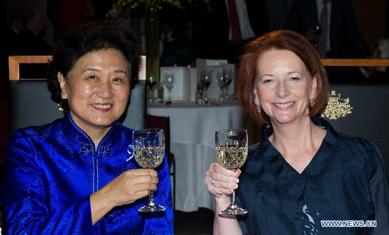 Visiting Chinese State Councilor Liu Yandong (L) and Australian Prime Minister Julia Gillard attends a ceremony marking the 40th anniversary of China-Australia ties in Canberra on Dec. 12, 2012. [Xinhua photo]