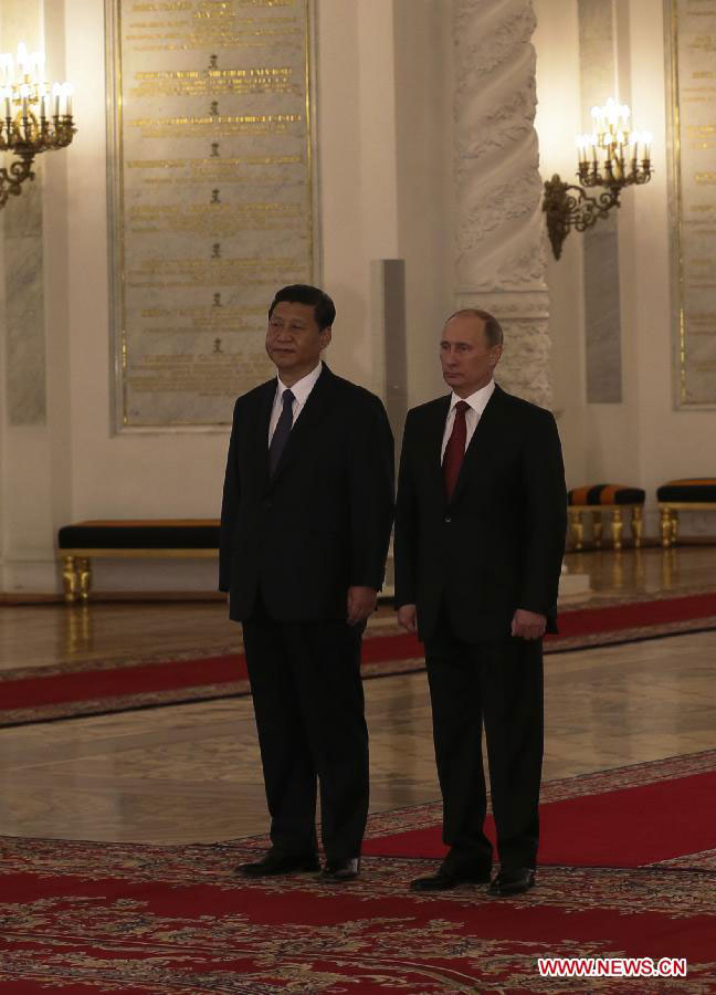 Chinese President Xi Jinping (L) is welcomed by Russian President Vladimir Putin at the Kremlin Palace in Moscow, capital of Russia, March 22, 2013. Chinese President Xi Jinping arrived in Moscow Friday for a state visit to Russia. (Xinhua/