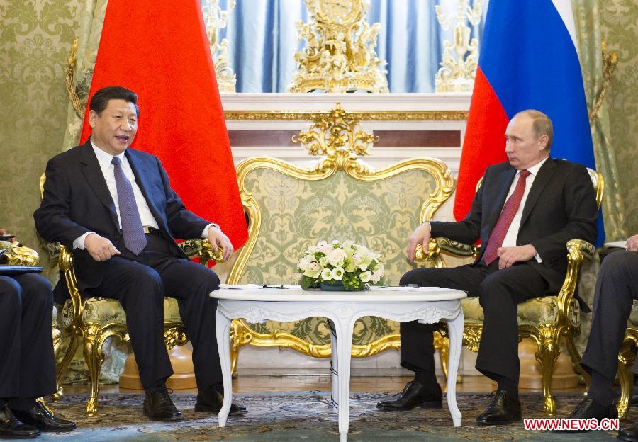Chinese President Xi Jinping (L) meets with Russian President Vladimir Putin, in Moscow, capital of Russia, March 22, 2013. (Xinhua/