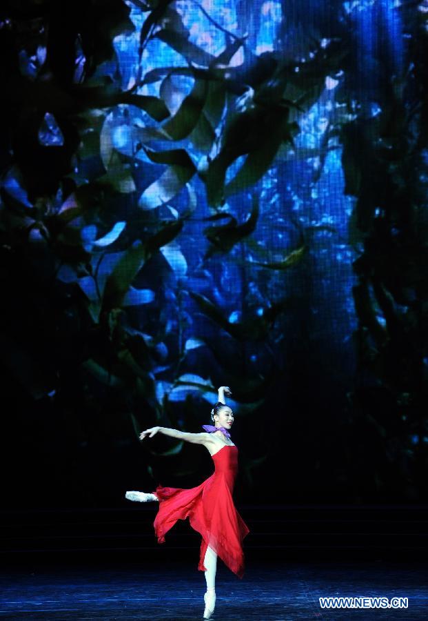 Artists perform during the opening ceremony of the 'Tourism Year of China' in Moscow, March 22, 2013. The 'China-Russia Tourism Year' program, which began last year with the 'Tourism Year of Russia' in China, aims to foster tourism ties and humanistic exchanges between the two countries. [Xinhua]