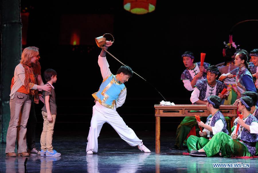 Artists perform during the opening ceremony of the 'Tourism Year of China' in Moscow, March 22, 2013. The 'China-Russia Tourism Year' program, which began last year with the 'Tourism Year of Russia' in China, aims to foster tourism ties and humanistic exchanges between the two countries. [Xinhua]