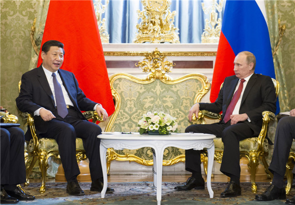 Chinese President Xi Jinping (L) meets with Russian President Vladimir Putin, in Moscow, capital of Russia, March 22, 2013. [Photo/Xinhua]
