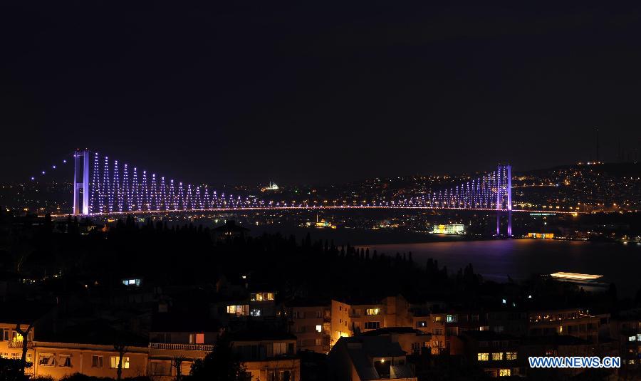 The Galata Tower turns off the lights to mark the annual &apos;Earth Hour&apos; event in Istanbul of Turkey on March 23, 2013. (Xinhua/Ma Yan)