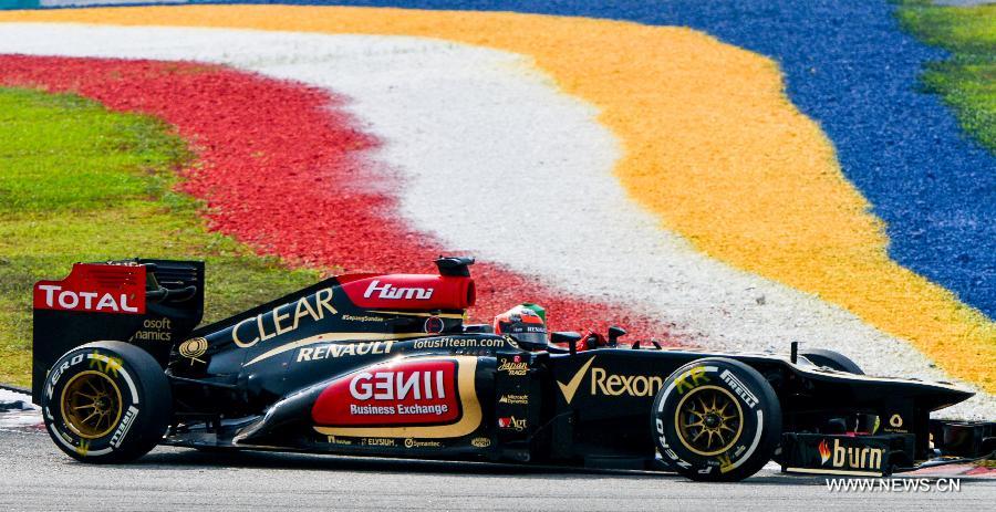 Lotus driver Kimi Raikkonen of Finland steers his car during the qualifying session for the Malaysian F1 Grand Prix at Sepang International Circuit outside Kuala Lumpur, Malaysia, March 23, 2013. (Xinhua/Zhang Wenzong)