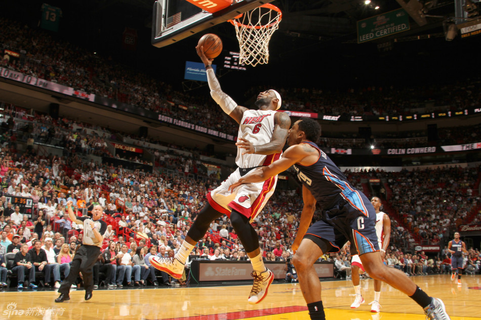 LeBron James goes up for a basket in a NBA game between Charlotte Bobcats and Miami Heat on March 24, 2013.