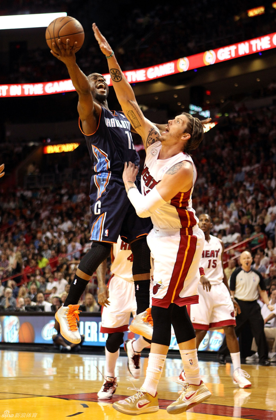 Mike Miller stops Kemba Walker's layup in a NBA game between Charlotte Bobcats and Miami Heat on March 24, 2013. 