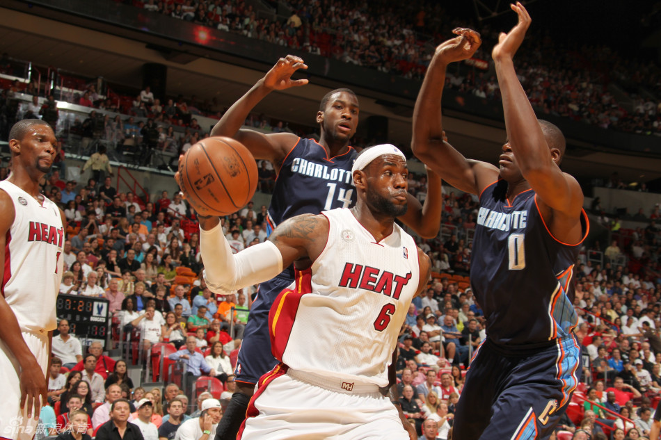 LeBron James tries to pass the ball in a NBA game between Charlotte Bobcats and Miami Heat on March 24, 2013. 