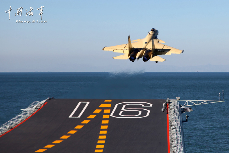 A PLA Navy's J-15 jet fighter practises take-off and landing on the country's first aircraft carrier, the Liaoning. [Photo / Navy.81.cn]