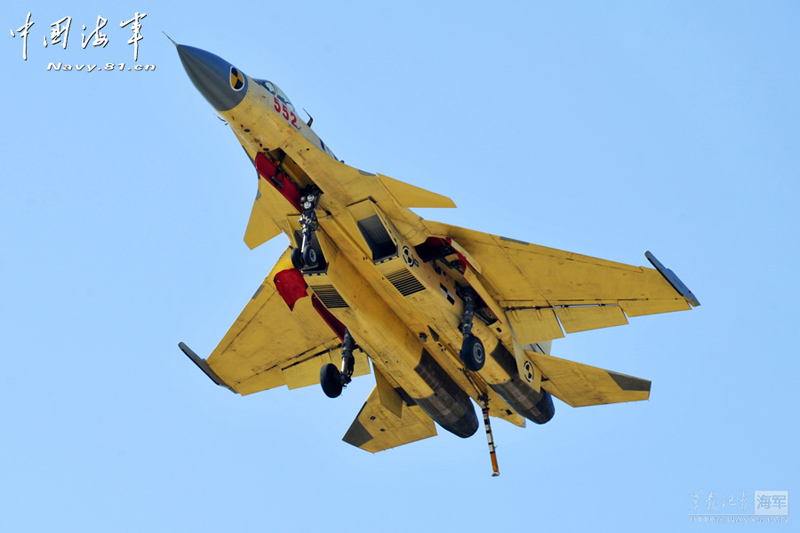 A PLA Navy's J-15 jet fighter practises take-off and landing on the country's first aircraft carrier, the Liaoning. [Photo / Navy.81.cn]