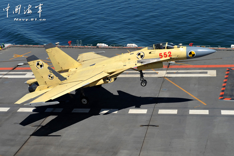 A PLA Navy&apos;s J-15 jet fighter practises take-off and landing on the country&apos;s first aircraft carrier, the Liaoning. [Photo / Navy.81.cn]