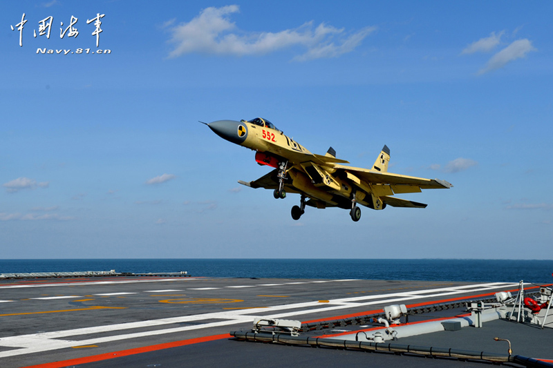 A PLA Navy&apos;s J-15 jet fighter practises take-off and landing on the country&apos;s first aircraft carrier, the Liaoning. [Photo / Navy.81.cn]