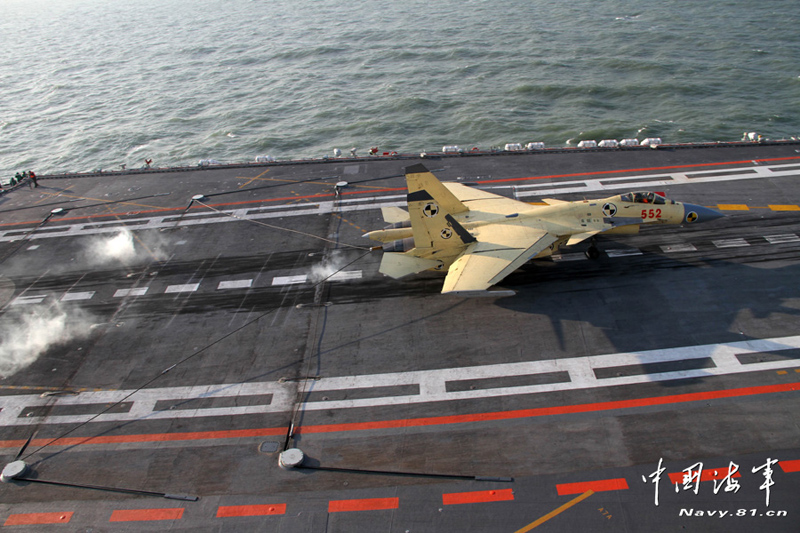 A PLA Navy's J-15 jet fighter practises take-off and landing on the country's first aircraft carrier, the Liaoning. [Photo / Navy.81.cn]