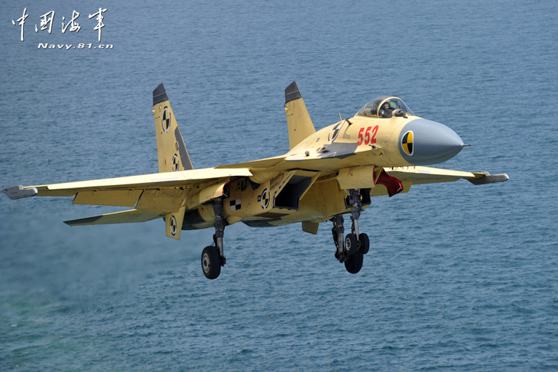 A PLA Navy's J-15 jet fighter practises take-off and landing on the country's first aircraft carrier, the Liaoning. [Photo / Navy.81.cn]