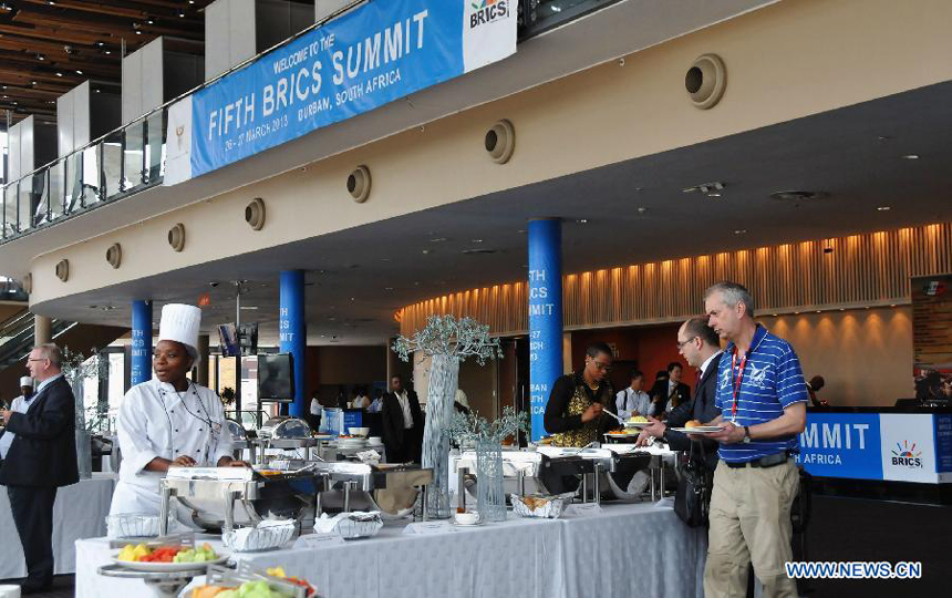 Delegates enjoy lunch at the International Convention Centre (ICC) in South Africa&apos;s port city of Durban, March 26, 2013. South Africa will host the fifth BRICS Summit from March 26 to 27, 2013, at the Durban International Convention Center (ICC). 