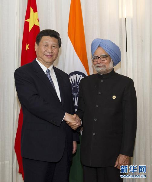Chinese President Xi Jinping has met with Indian Prime Minister Manmohan Singh and Brazilian President Dilma Rousseff on the sidelines of the 5th BRICS Summit in Durban, South Africa. 
