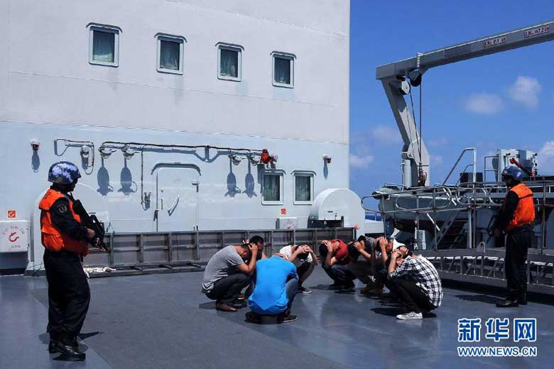 Marines guard &apos;suspects&apos; during a maritime exercise conducted on March 28, 2013, by a contingent of China&apos;s South Sea Fleet that is on a patrol mission in South China Sea.[Photo:Xinhua] 