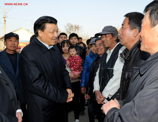 Photo taken on March 28, 2013 shows Liu Yunshan, a member of the Standing Committee of the Political Bureau of the Communist Party of China (CPC) Central Committee, talks with local villagers during an inspection in Tianjin Municipality, north China. Liu Yunshan made an inspection in Tianjin on Thursday afternoon and Friday. [Rao Aimin/Xinhua]