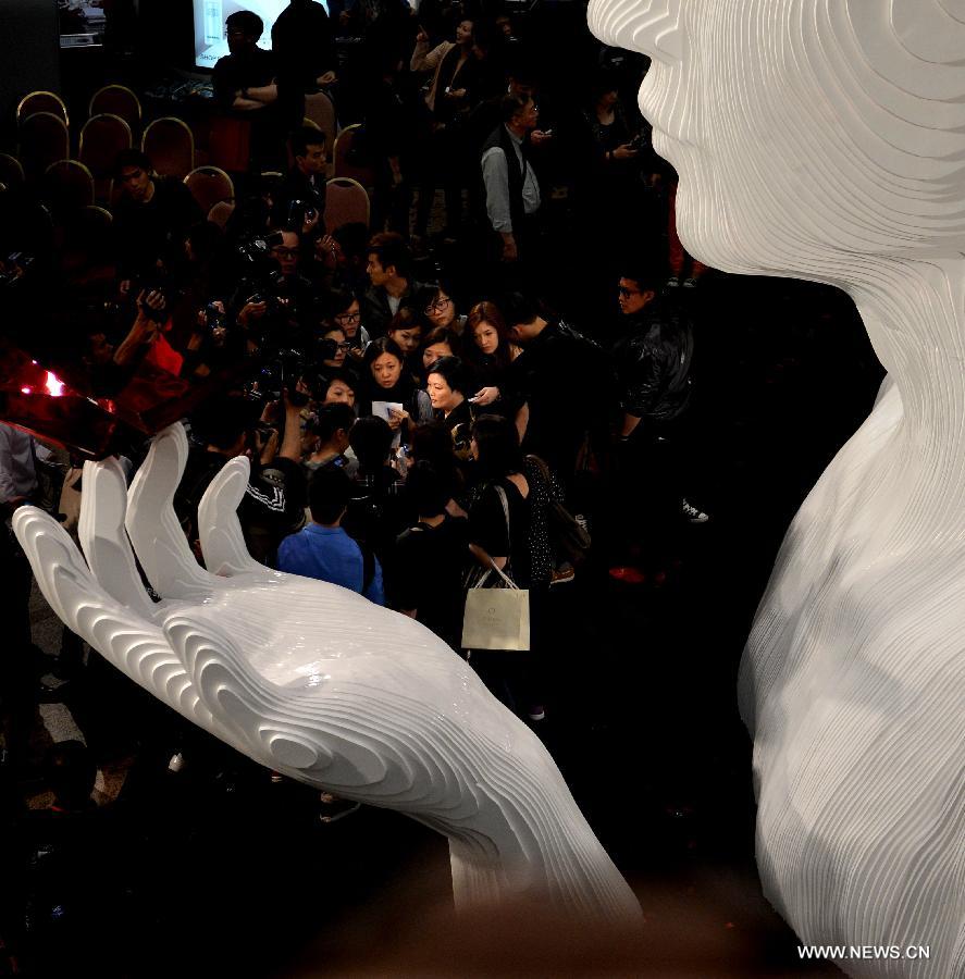 A five-metre-high sculpture of late Hong Kong singer Leslie Cheung is seen displayed at an exhibition for paying tribute to Cheung in Hong Kong, south China, March 30, 2013. The exhibition is held to mark the 10th anniversary of the death of Leslie Cheung, who leapt to his death from a hotel in Hong Kong on April 1, 2003. 