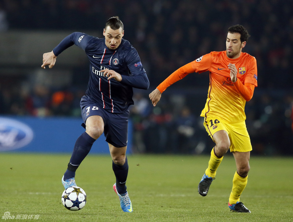 Ibrahimovic drives past Busquets. 