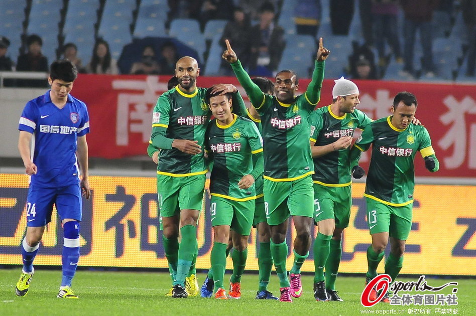 Beijing Guoan players celebrate scoring in a CSL match between Jiangsu Sainty and Beijing Guoan in Nanjing, Jiangsu Province on April 5, 2013. 