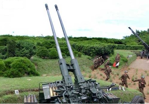 Photo shows a KPA antiaircraft gun (AA Gun) battery. North Korea does not have advanced surface-to-air missiles, and relies on small-calibre AA Guns for its air defenses, which have limited effect against U.S. and South Korean air forces.